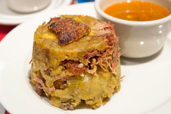 Mofongo with pernil asado and chicharrón from Casa Adela